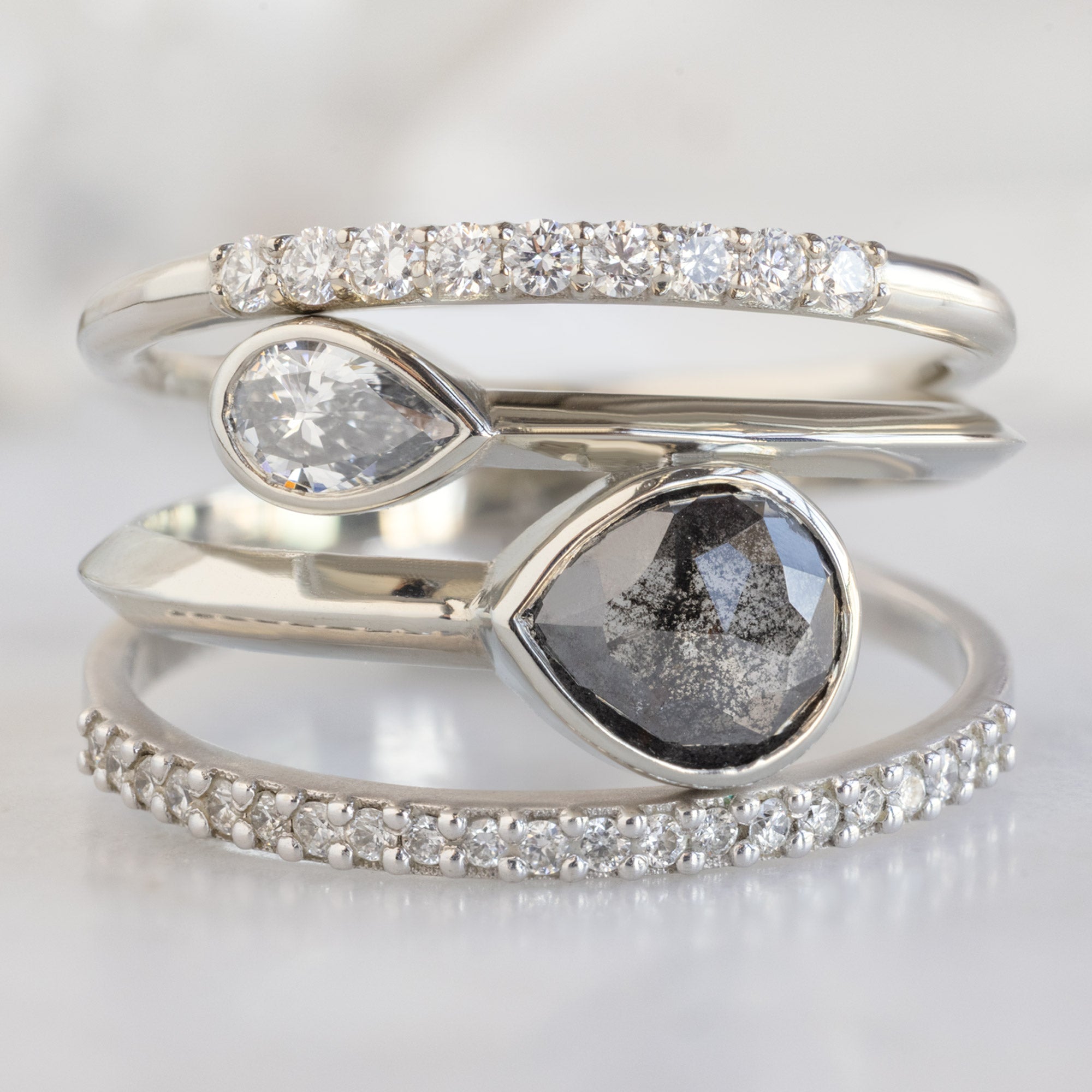 buy:the-luxe-white-diamond-pave-wedding-band-yellow-rose-or-white-gold,the-wrap-ring-with-a-71ct-pear-black-diamond-in-14k-white-gold,the-white-diamond-pave-wedding-band-14k-or-18k-yellow-gold