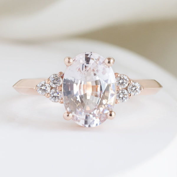 The Ivy Luxe with a 2.12ct Oval Peach Sapphire in 18K Rose Gold on White Marble