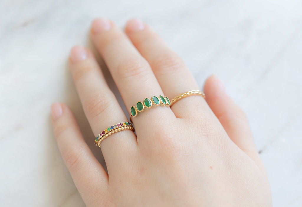 Emerald Gemstone Eternity Ring Stacked on Model