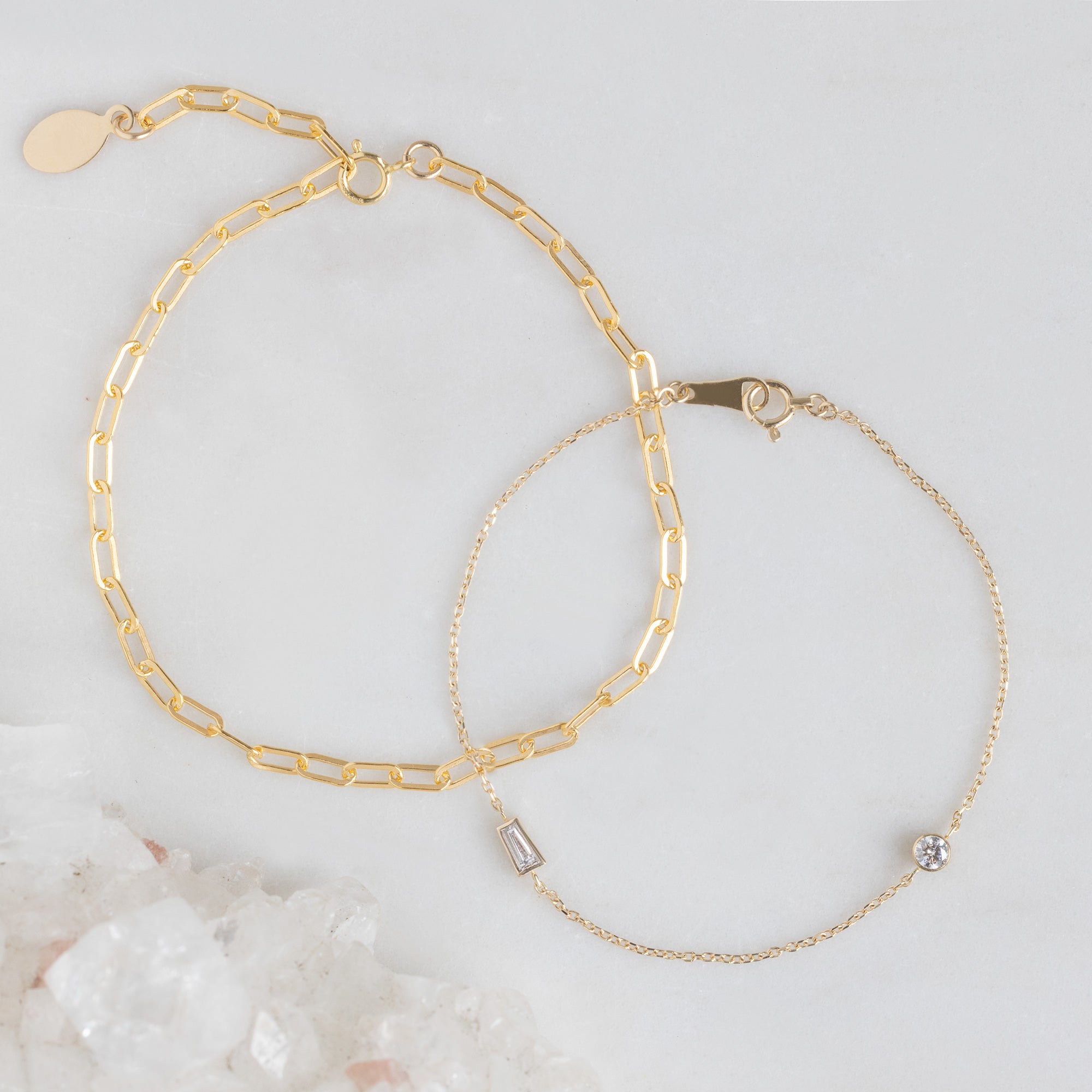 The Petite Bracelet Set in Yellow Gold on White Marble Surface