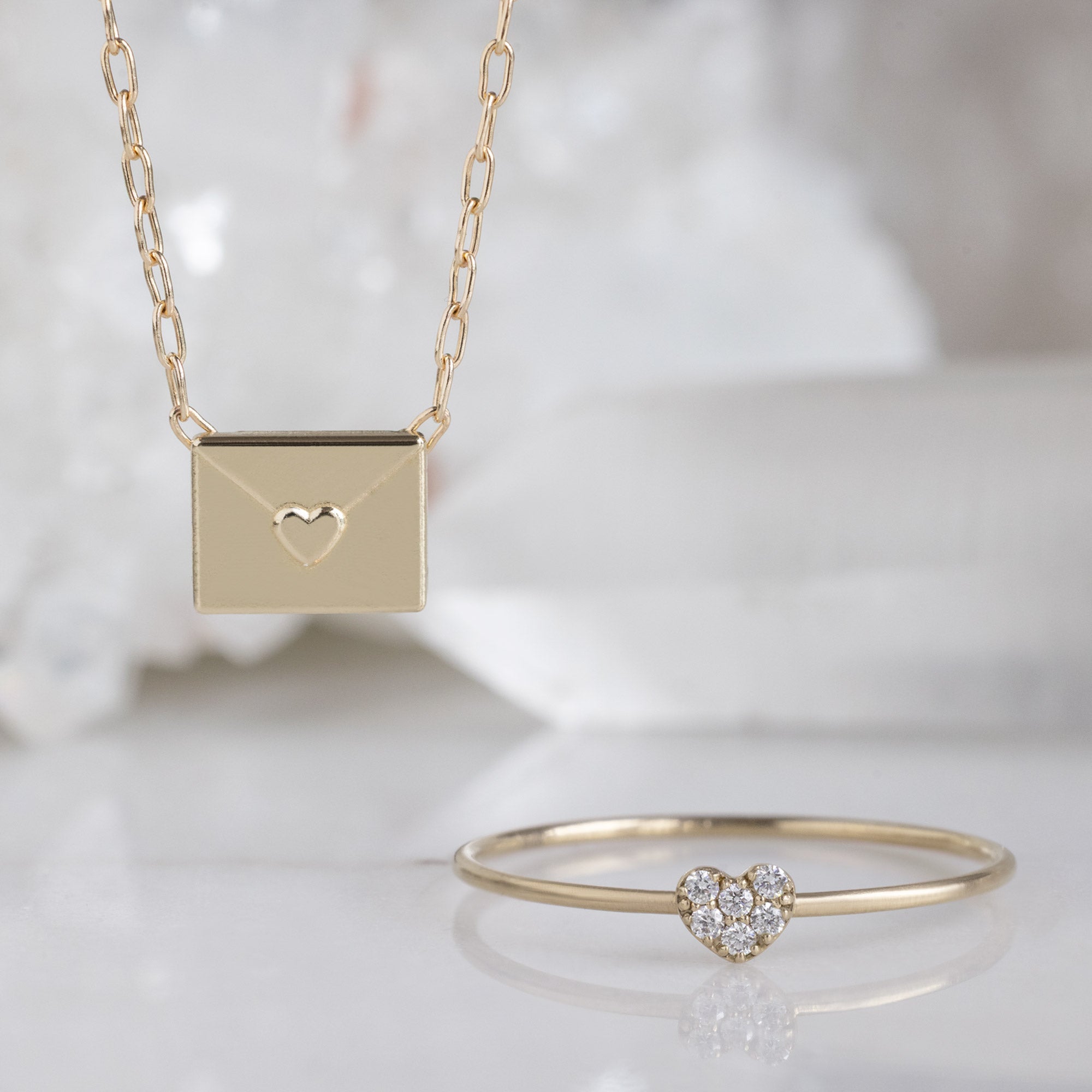 The Layering Chain Set in Yellow Gold on White Marble Surface