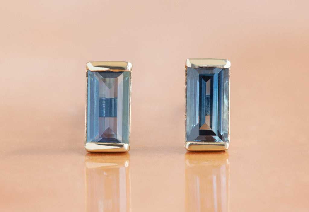 Montana Sapphire Baguette Studs on Orange Background