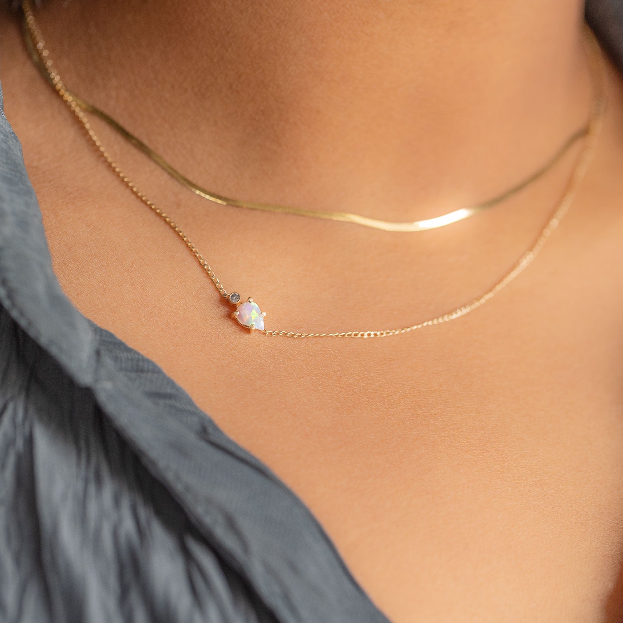 buy:the-herringbone-chain-necklace-14k-yellow-gold,the-asymmetrical-opal-diamond-necklace-gold-filled