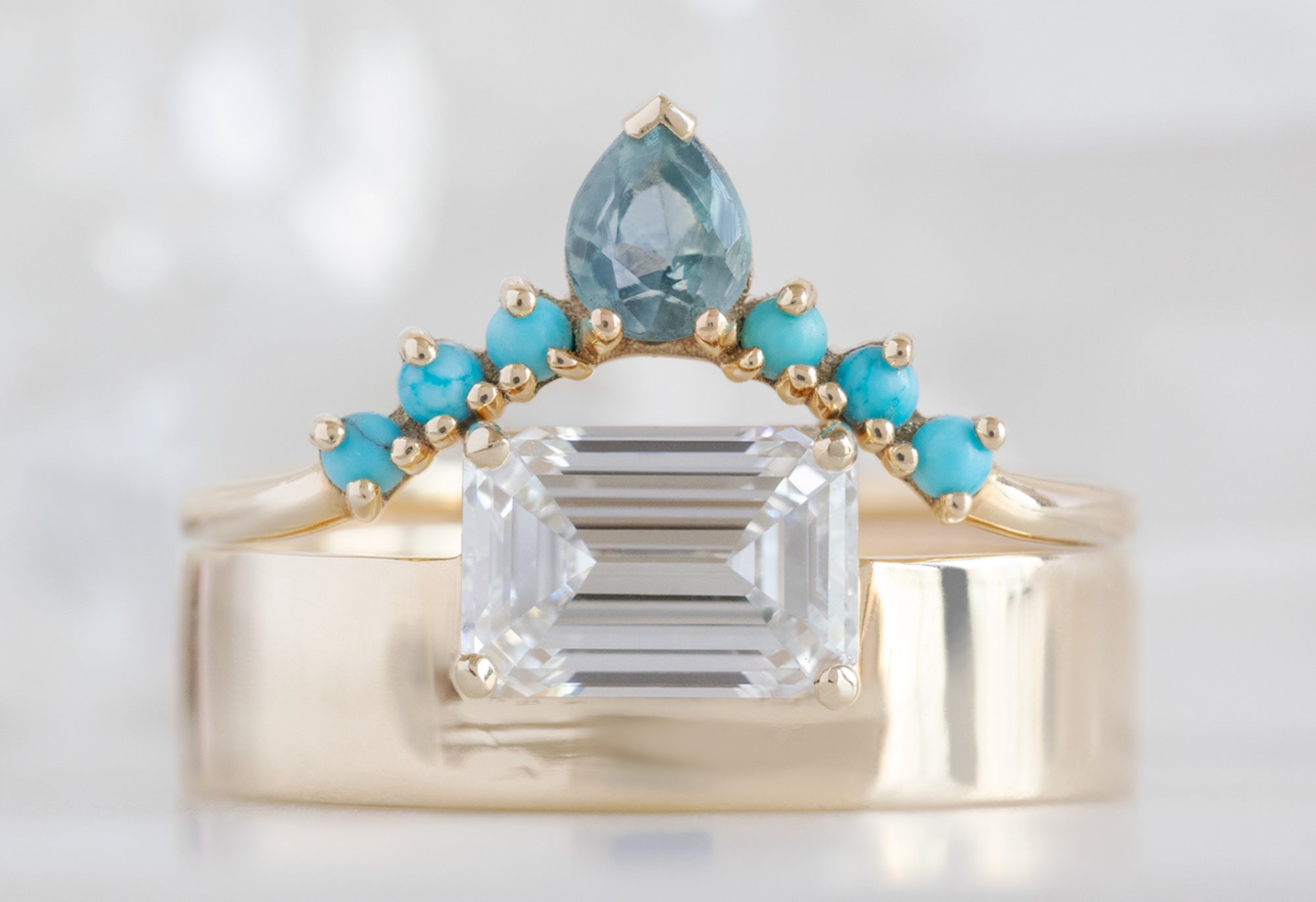 One of a Kind Cigar Band with an Emerald-Cut Lab Grown Diamond with Sapphire and Turquoise Sunburst Stacking Band