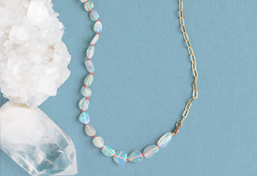 Knotted Opal Necklace on Sky Blue Textured Paper