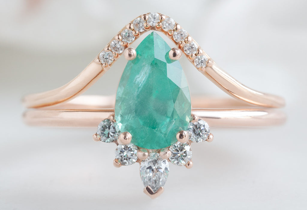 The Aster Ring with a Pear-Cut Emerald with Pavé Arc Stacking Band