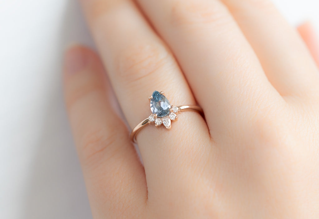 The Aster Ring with a Pear-Cut Montana Sapphire on Model