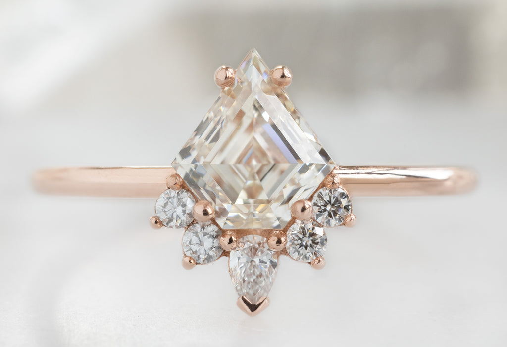 The Aster Ring with a Shield-Cut White Diamond
