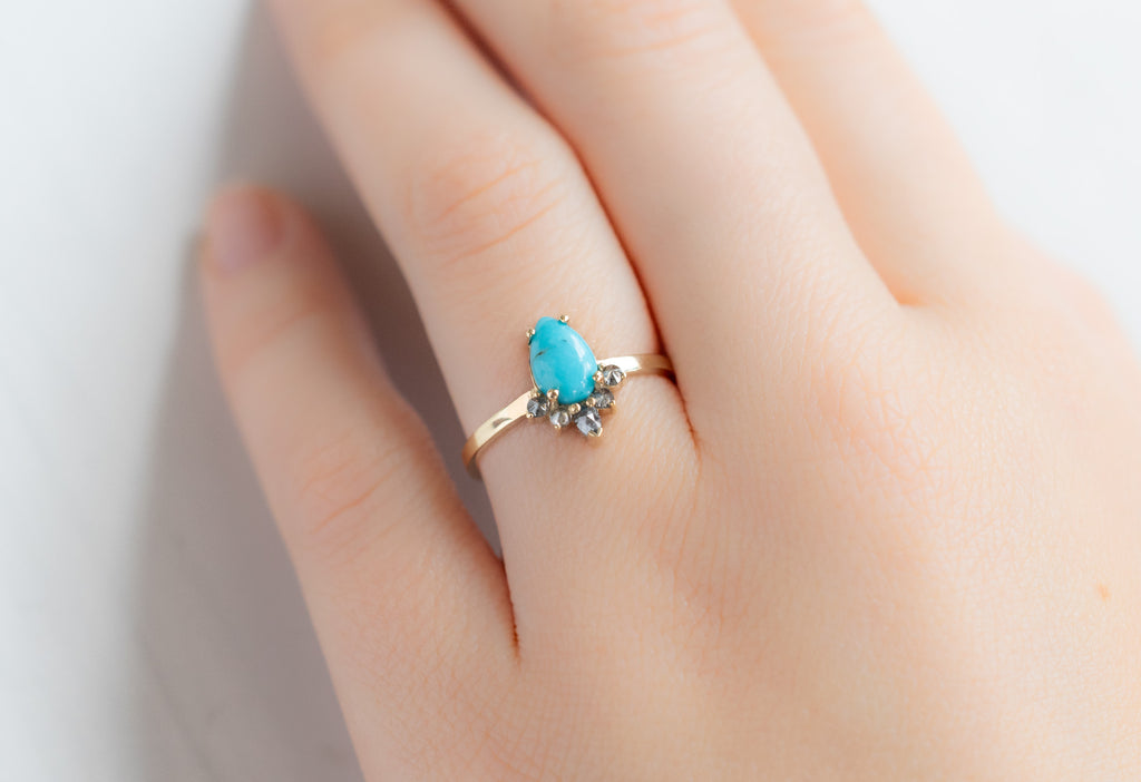 The Aster Ring with a Sleeping Beauty Pear Shaped Turquoise on Model