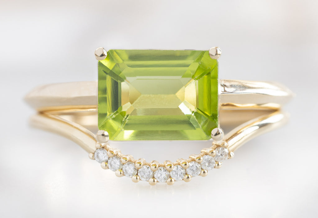 The Bryn Ring with an Emerald-Cut Peridot with Pavé Arc Stacking Band