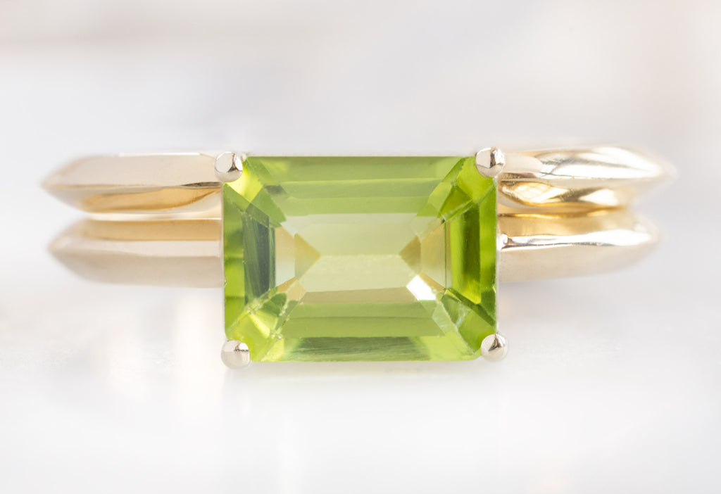The Bryn Ring with an Emerald-Cut Peridot with Open Cuff Knife Edge Stacking Band