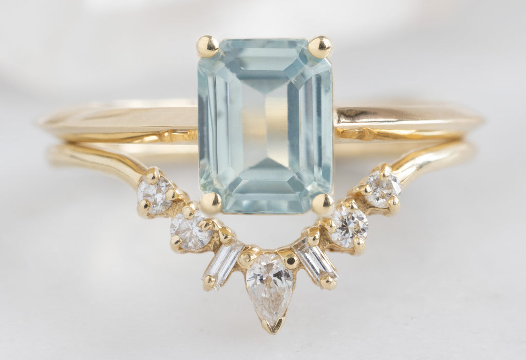 The Bryn Ring with an Emerald-Cut Sapphire with Geometric Diamond Sunburst Stacking Band