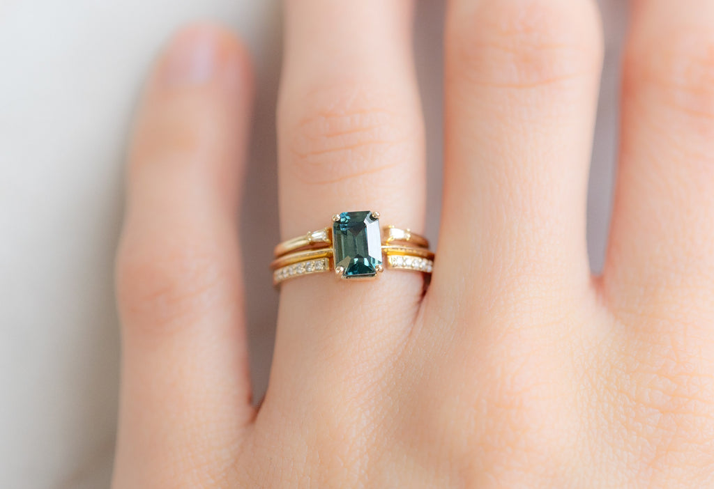 The Bryn Ring with an Emerald-Cut Sapphire with Open Cuff White Diamond Stacking Bands on Model