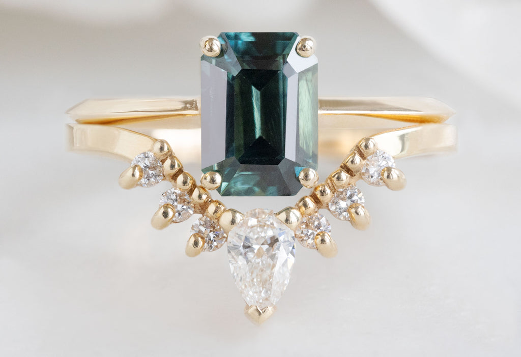 The Bryn Ring with an Emerald-Cut Sapphire with White Diamond Sunburst Stacking Band