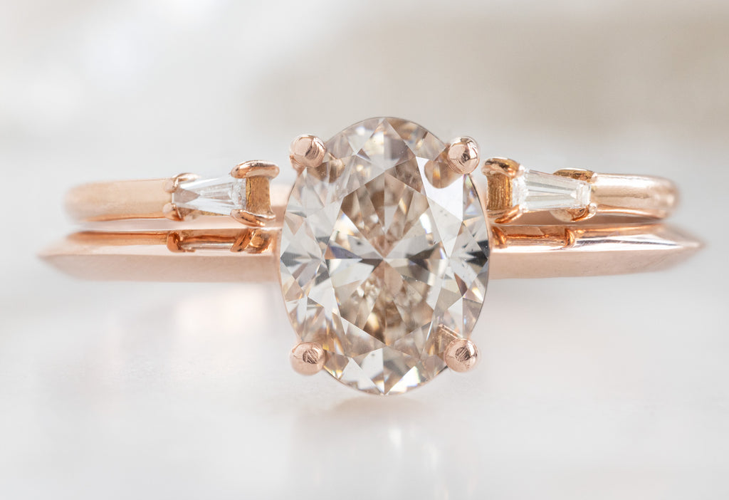 The Bryn Ring with an Oval-Cut Champagne Diamond with Open Cuff Baguette Diamond Stacking Band