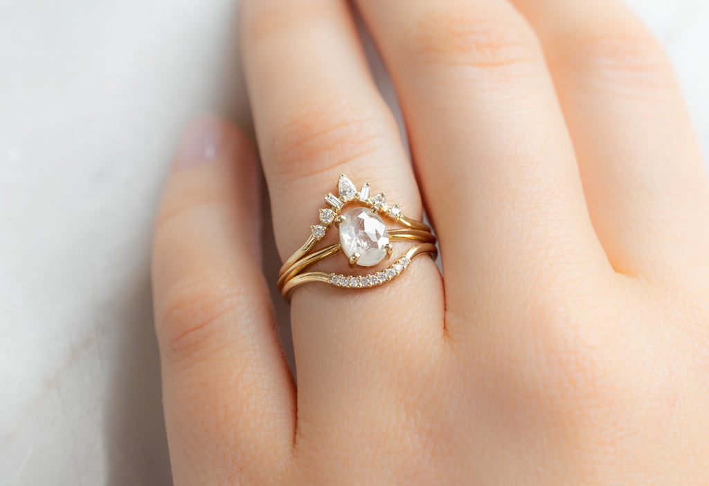 The Bryn Ring with an Oval-Cut Icy-White Diamond with White Diamond Stacking Bands on Model
