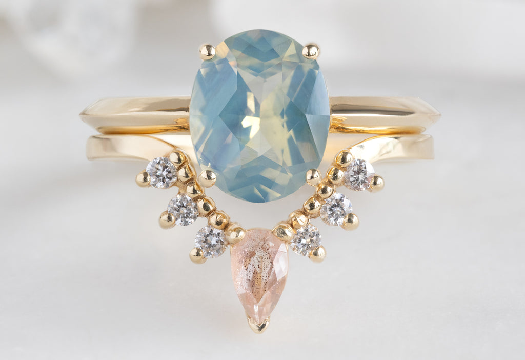 The Bryn Ring with an Oval-Cut Parti Sapphire with Sunstone and White Diamond Sunburst Stacking Band