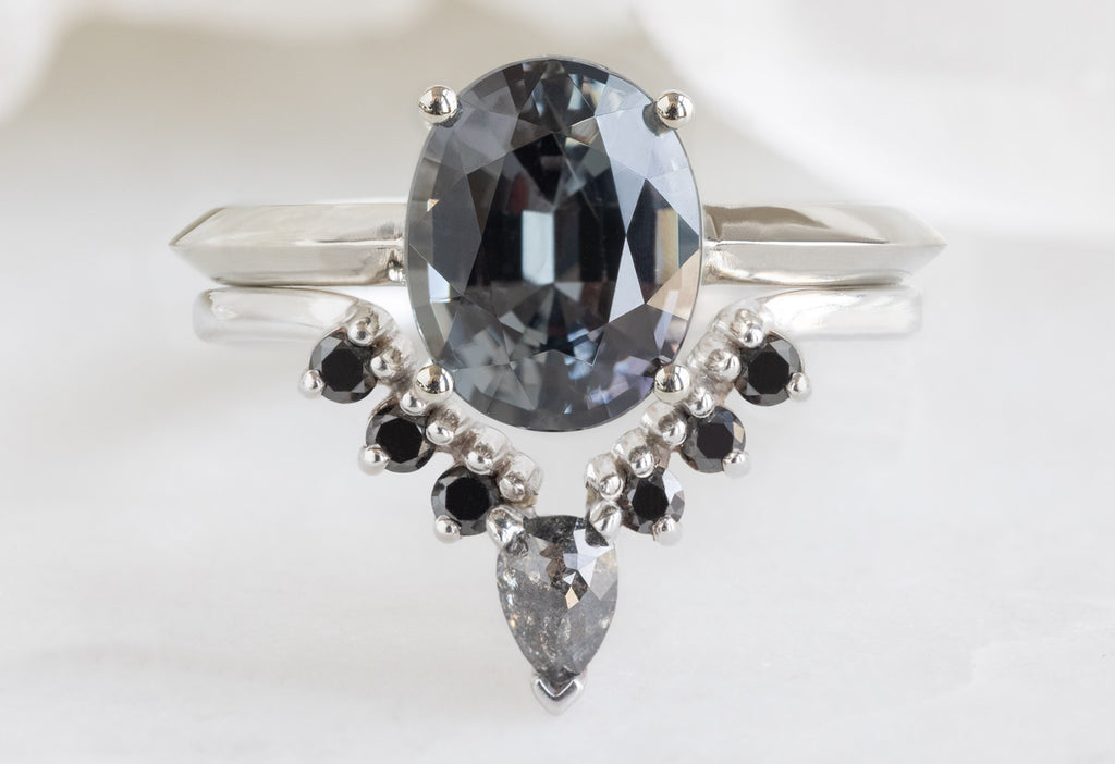 The Bryn Ring with an Oval-Cut Spinel with Black Diamond Sunburst Stacking Band