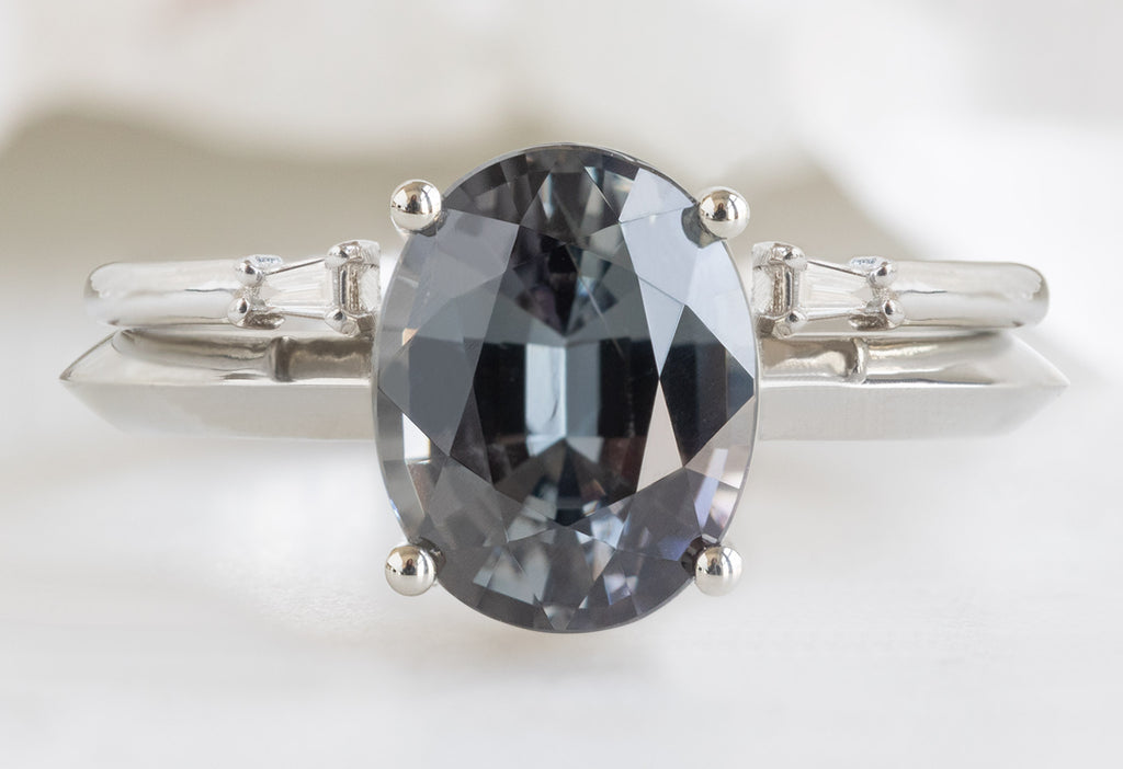 The Bryn Ring with an Oval-Cut Spinel with Open Cuff Baguette Diamond Stacking Band