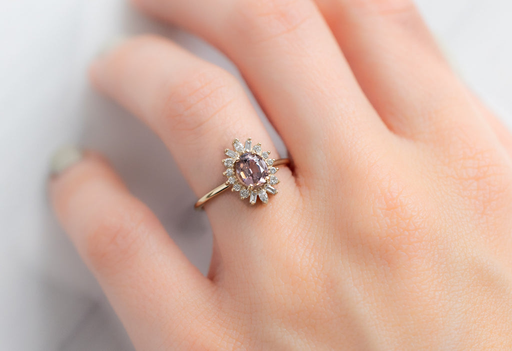 The Camellia Ring with a Sunset Spinel on Model