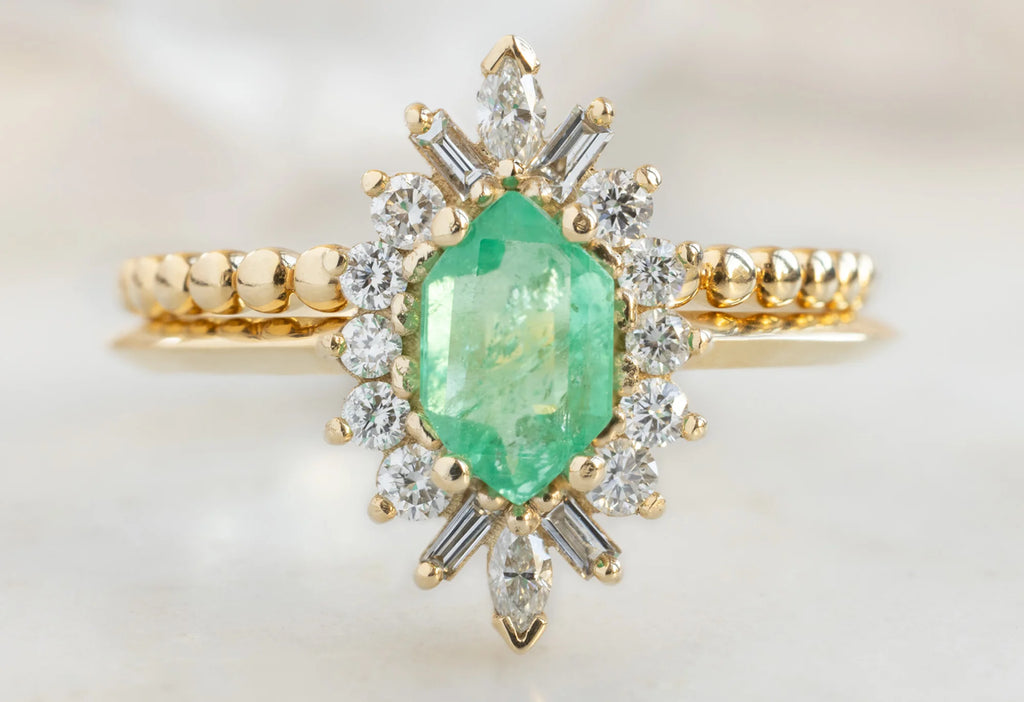 The Camellia Ring with an Emerald Hexagon with Beaded Stacking Band