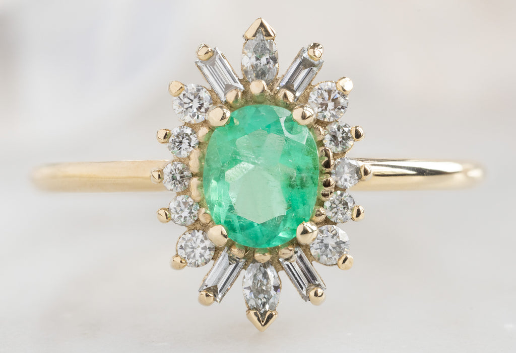 The Camellia Ring with an Oval-Cut Emerald