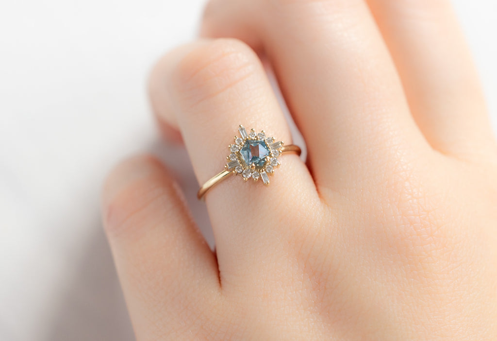The Compass Ring with a Montana Sapphire on Modle