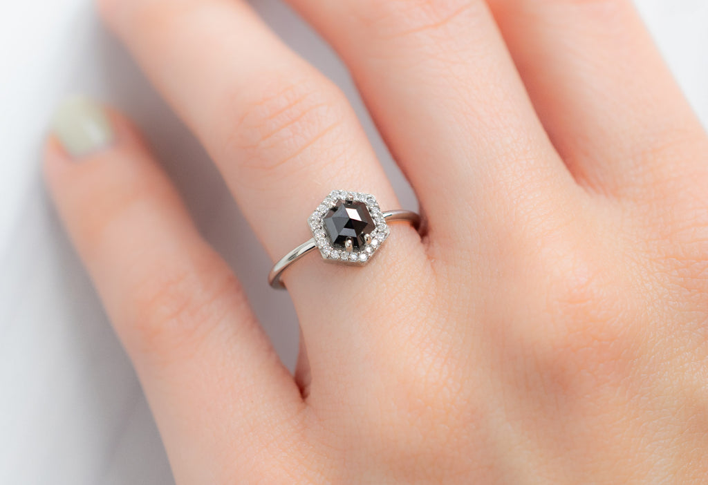 The Dahlia Ring with a Black Hexagon Diamond on Model