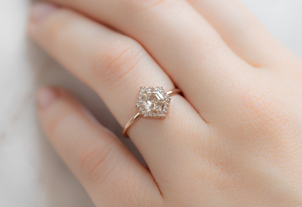 The Dahlia Ring with a Pink Hexagon Diamond on Model