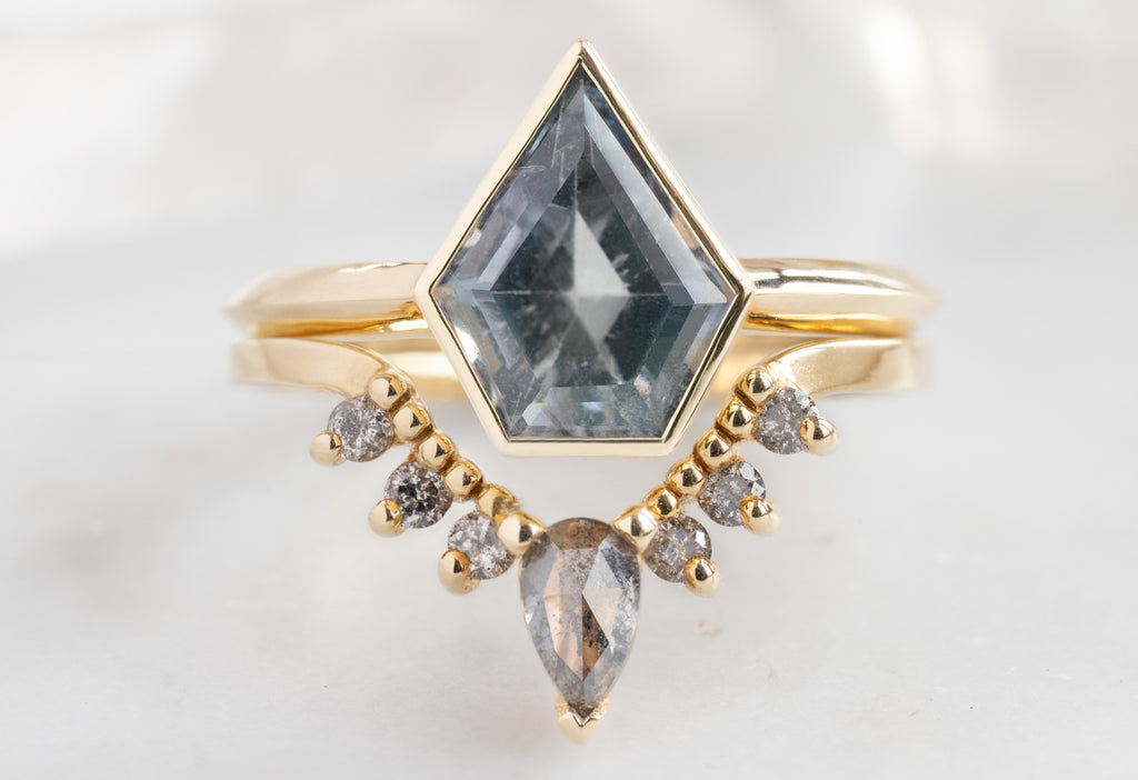 The Hazel Ring with a Shield-Cut Sapphire with Salt and Pepper Sunburst Stacking Band