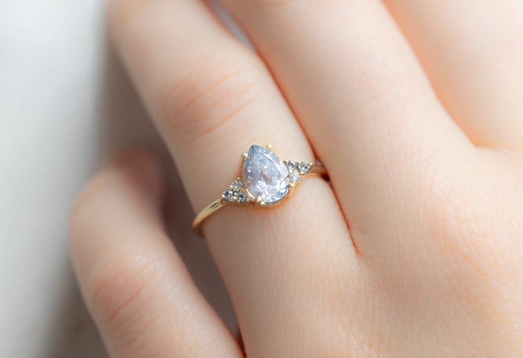 The Ivy Ring with a Pear-Cut Montana Sapphire on Model
