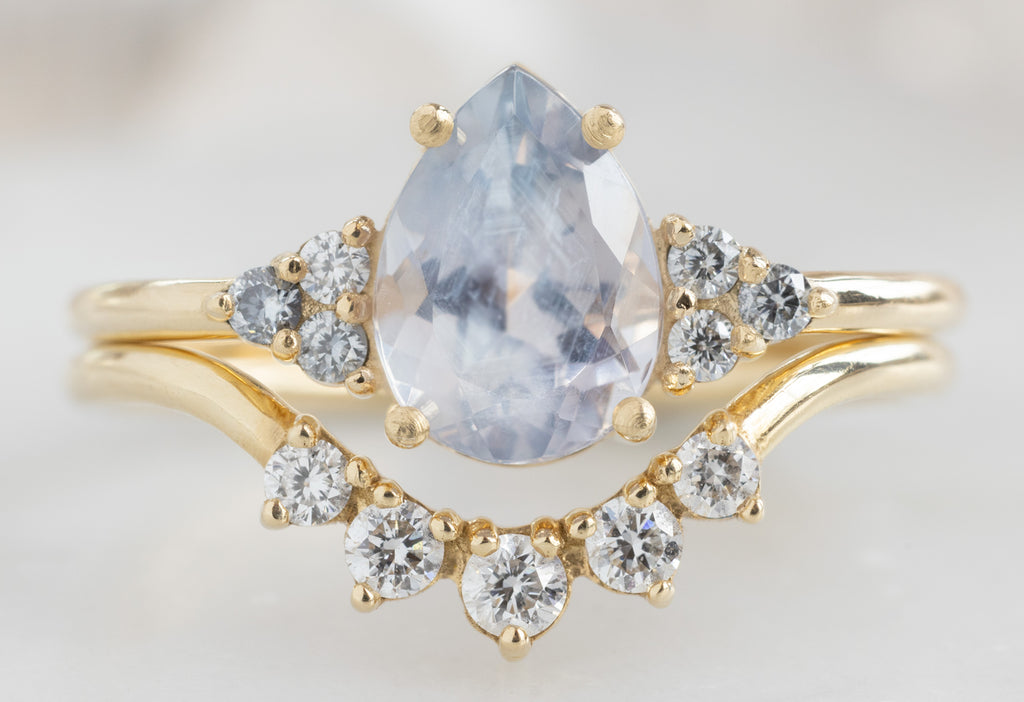 The Ivy Ring with a Pear-Cut Montana Sapphire with Round Diamond Sunburst Stacking Band