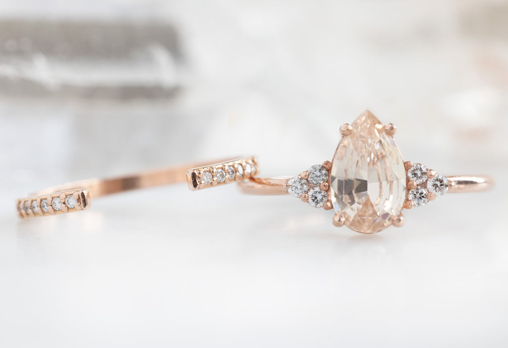 The Ivy Ring with a Pear-Cut Peach Sapphire with Open Cuff Pavé Diamond Stacking Band