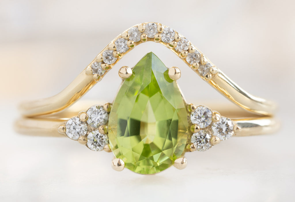 The Ivy Ring with a Pear-Cut Peridot with Pavé Peak Stacking Band