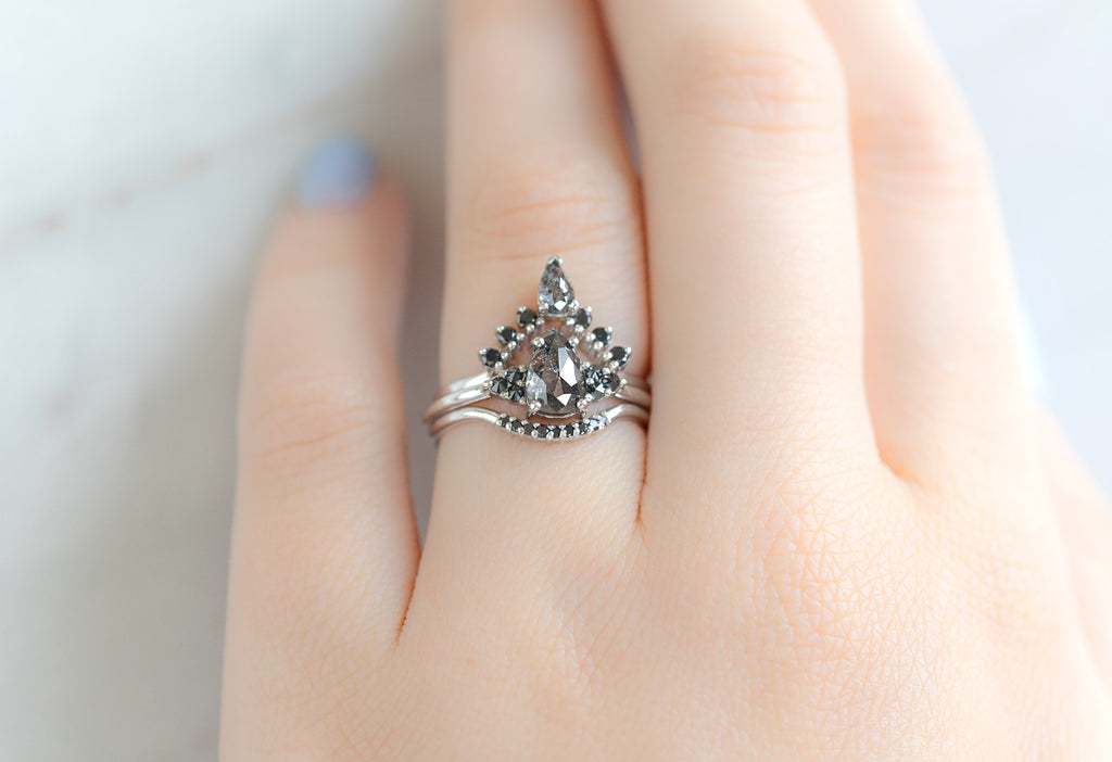The Ivy Ring with a Rose-Cut Black Diamond with Black Diamond Stacking Bands on Model