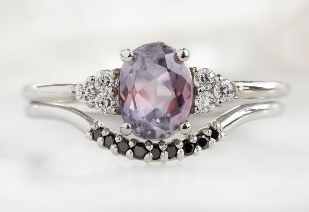 The Ivy Ring with an Oval-Cut Montana Sapphire with Pavé Black Diamond Stacking Band