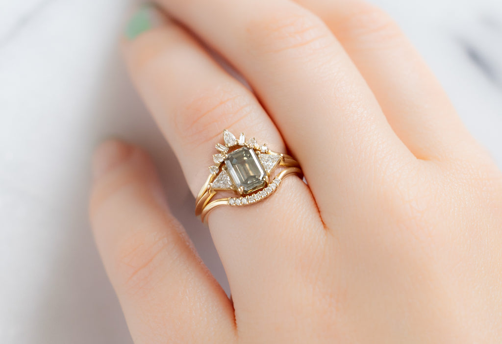 The Jade Ring with an Emerald-Cut Green Diamond with White Diamond Stacking Bands on Model