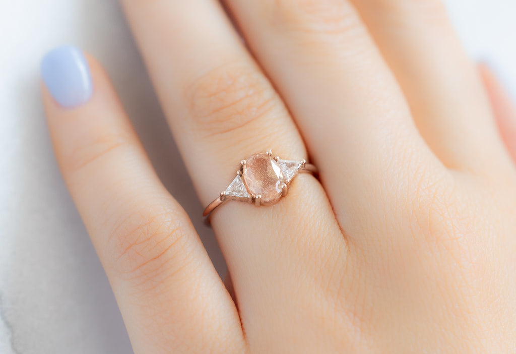 The Jade Ring with an Oval-Cut Sunstone on Model