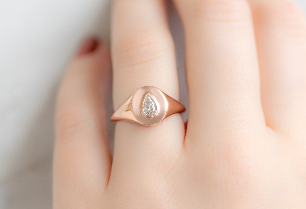 The Pear-Cut White Diamond Signet Ring on Model