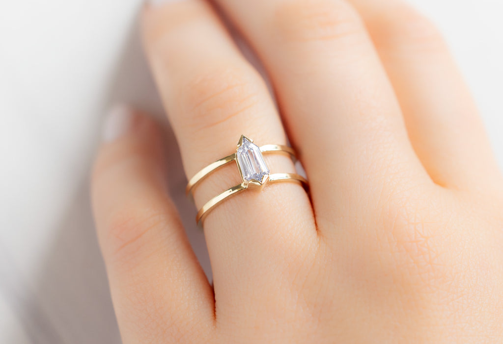 The Poppy Ring with a Geometric White Diamond on Model