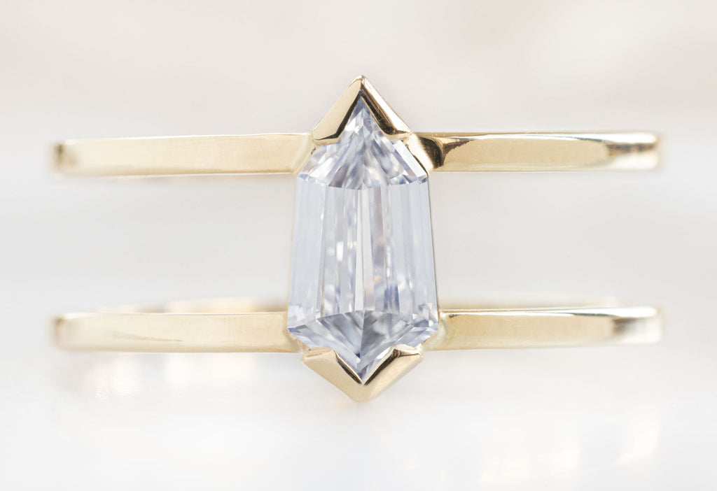 The Poppy Ring with a Geometric White Diamond on White Marble Tile