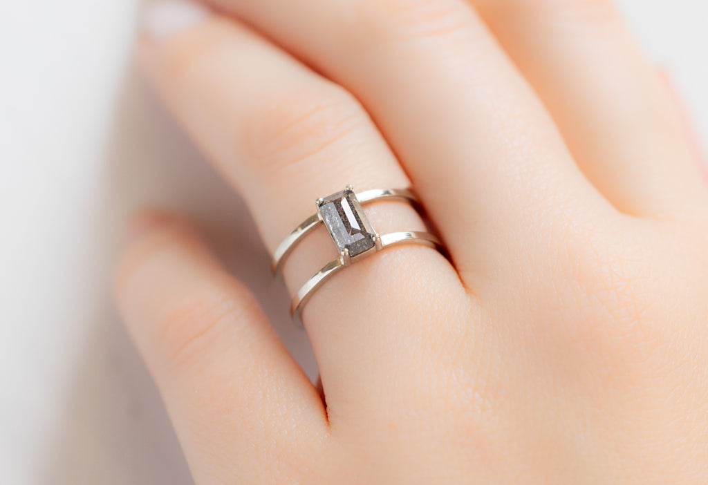 The Poppy Ring with an Emerald-Cut Salt and Pepper Diamond on Model