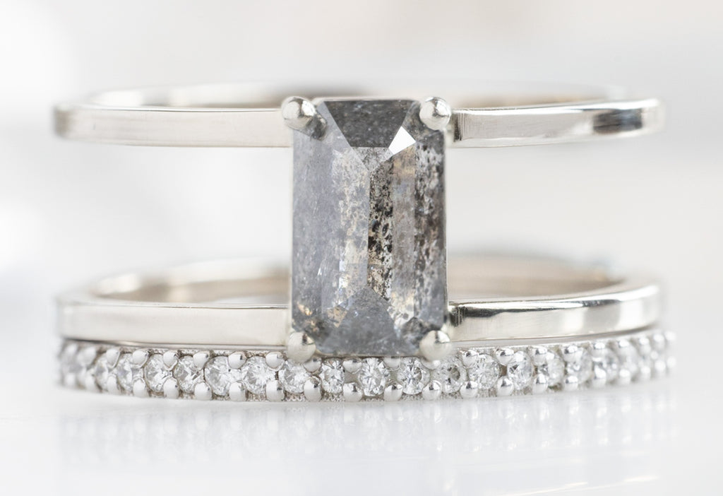 The Poppy Ring with an Emerald-Cut Salt and Pepper Diamond with Pavé Diamond Stacking Band