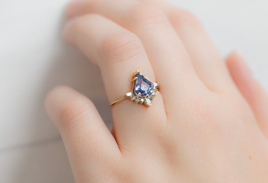 The Posy Ring with a Blue Violet Sapphire on Model