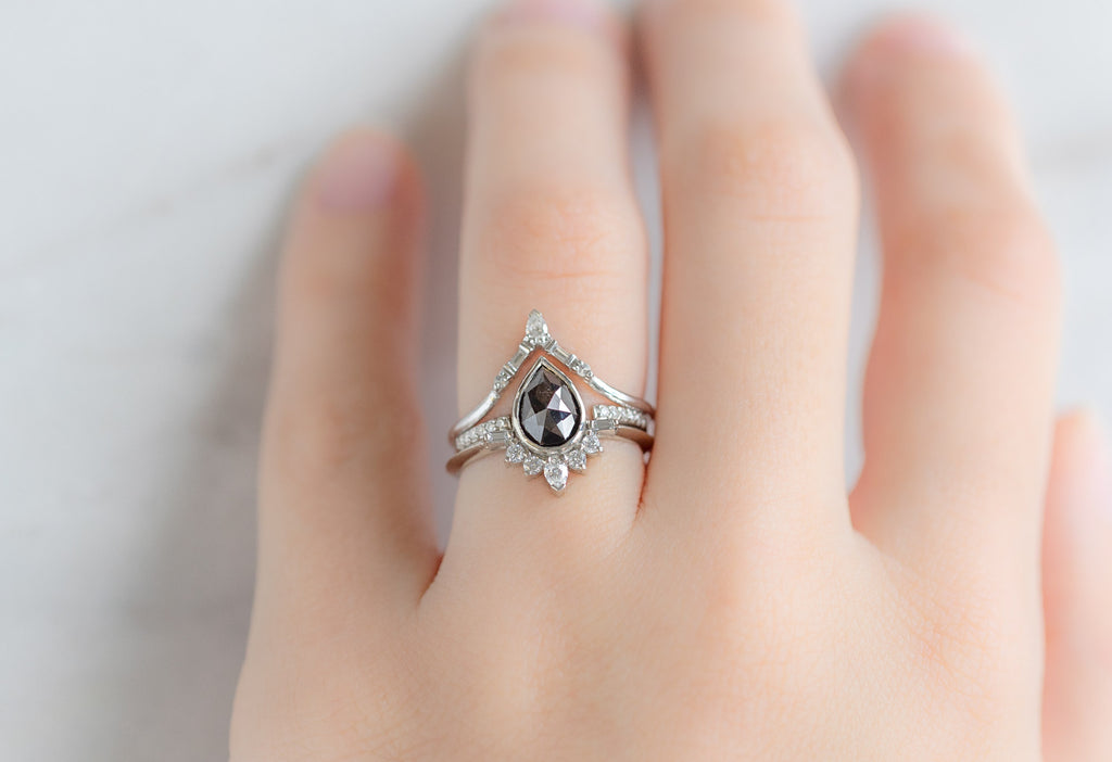 The Posy Ring with a Rose-Cut Black Diamond with White Diamond Stacking Bands on Model