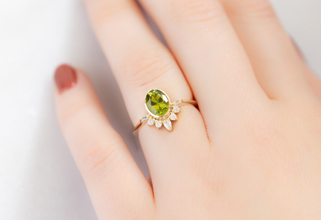 The Posy Ring with an Oval-Cut Peridot on Model