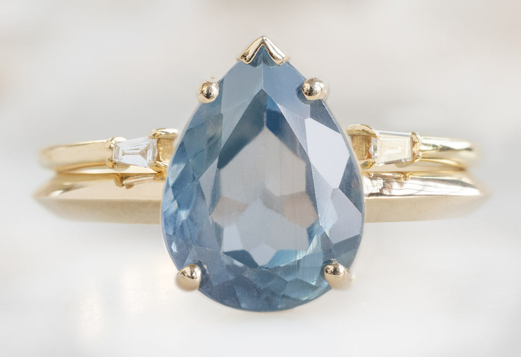 The Sage Ring with a Pear-Cut Montana Sapphire with Open Cuff Baguette Diamond Stacking Band
