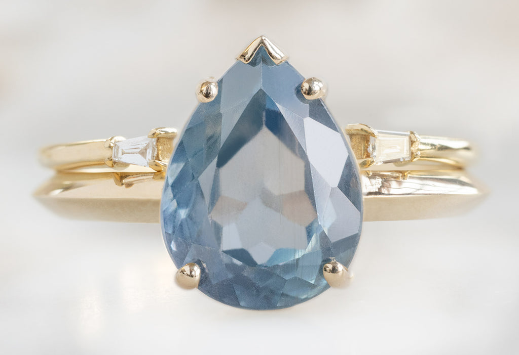 The Sage Ring with a Pear-Cut Montana Sapphire with Open Cuff Baguette Diamond Stacking Band
