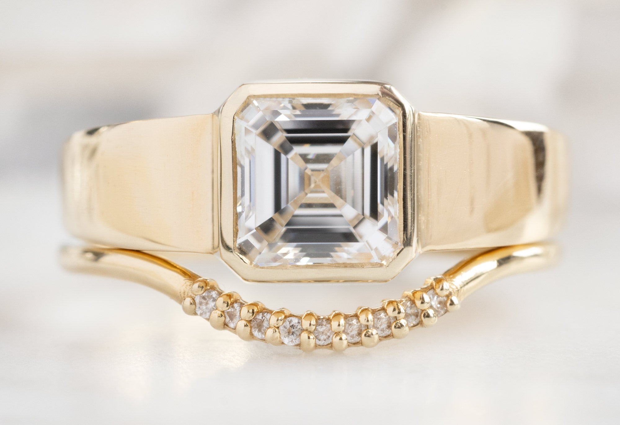 The Signet Ring with an Asscher-Cut Lab Grown Diamond with the Pavé Arc Stacking Band