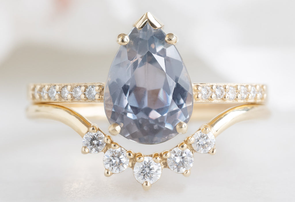 The Willow Ring with a Pear-Cut Lavender Sapphire with Round Diamond Sunburst Stacking Band